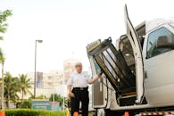 Security Guard Unloading Truck with Lift