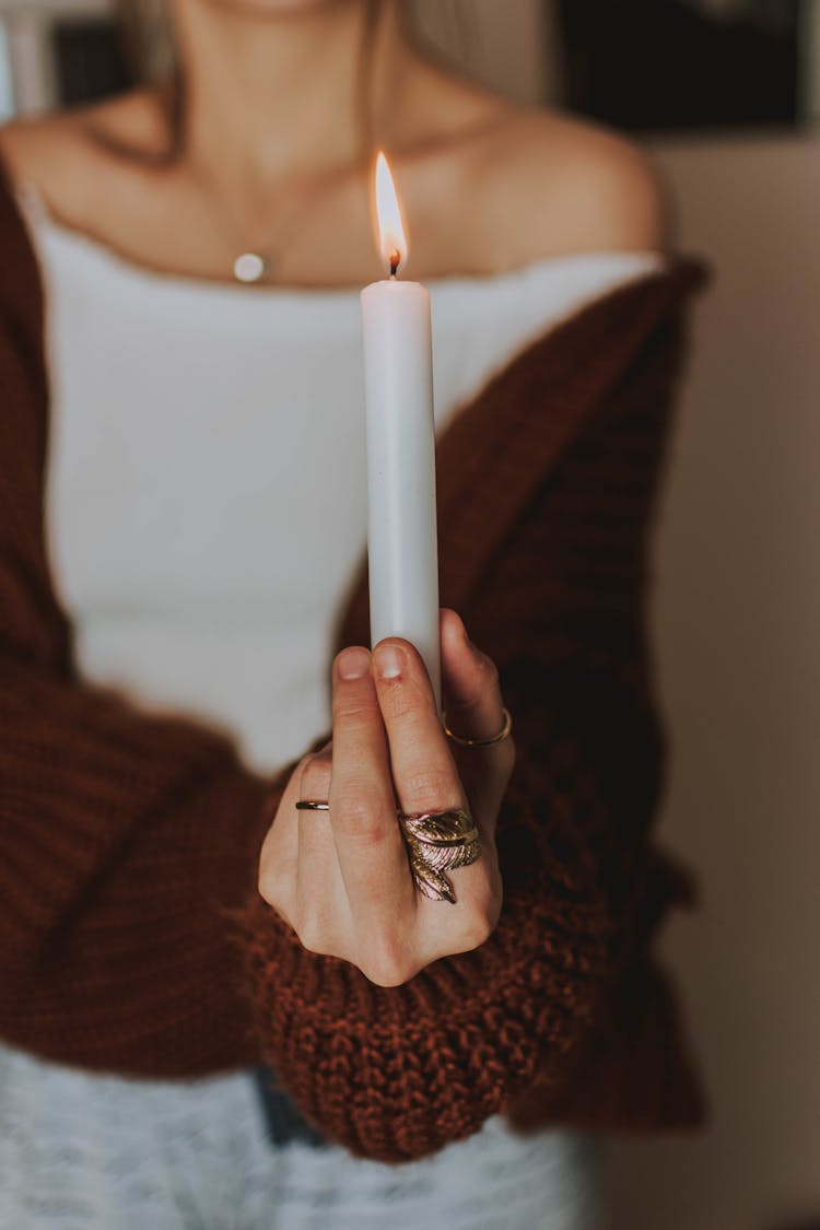 Person Holding White Candle