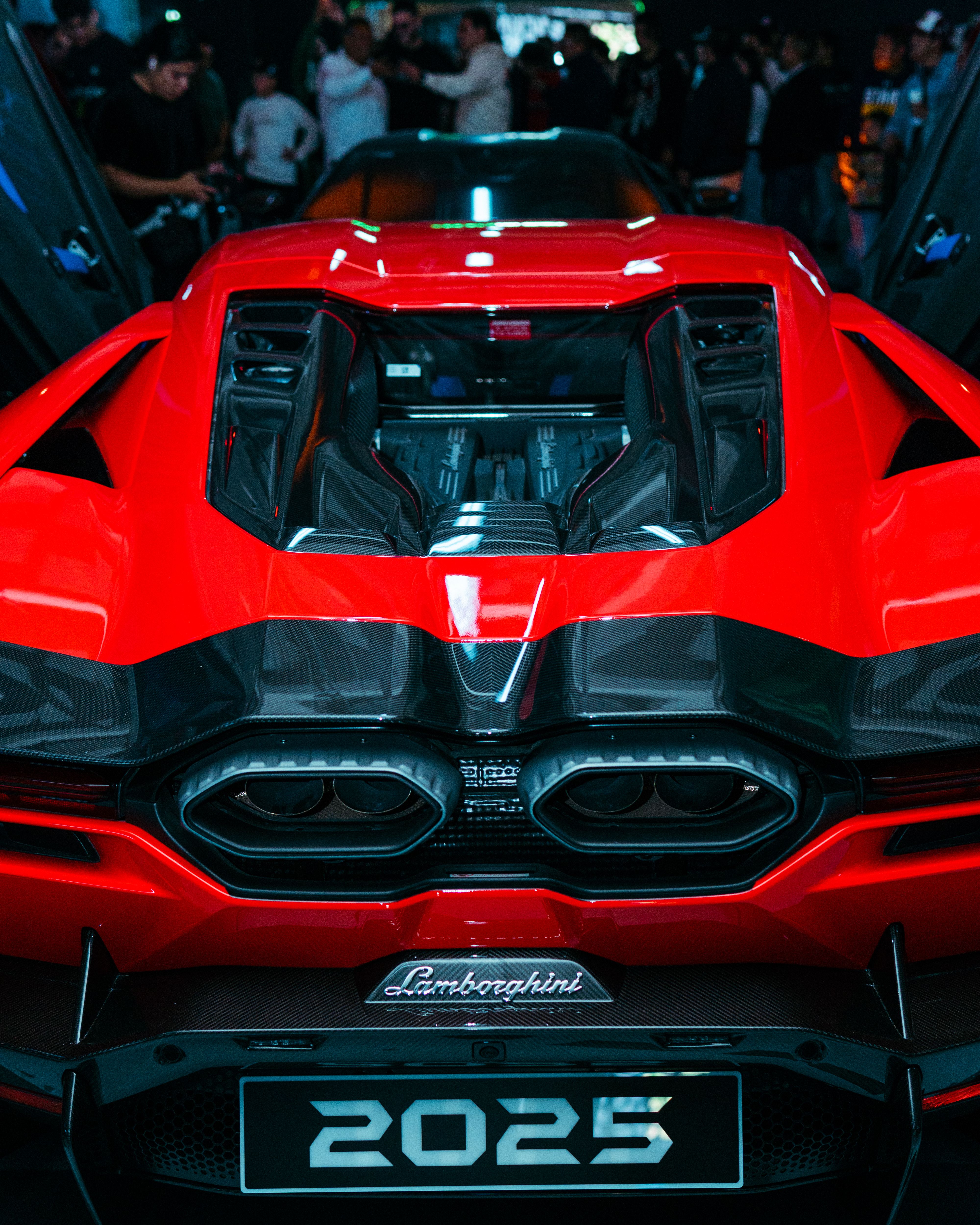 Stunning Red Sports Car Rear View at Auto Show · Free Stock Photo