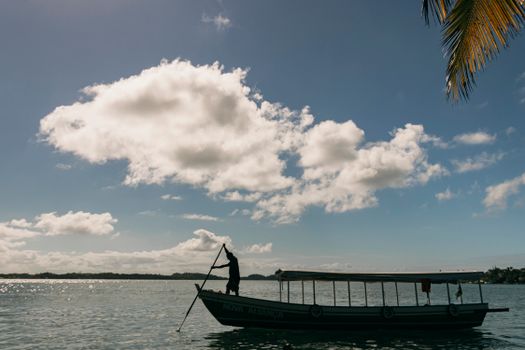A serene boat ride under the blue skies of Barra Grande, Bahia, Brazil.