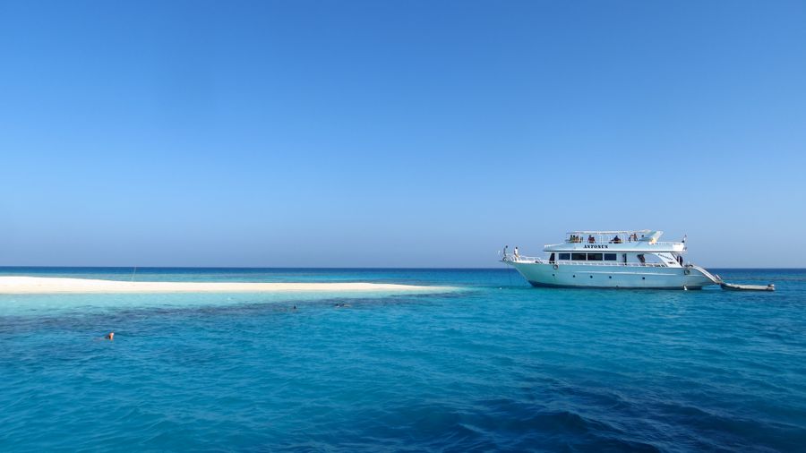 A pristine sandy island ringed by clear Red Sea water