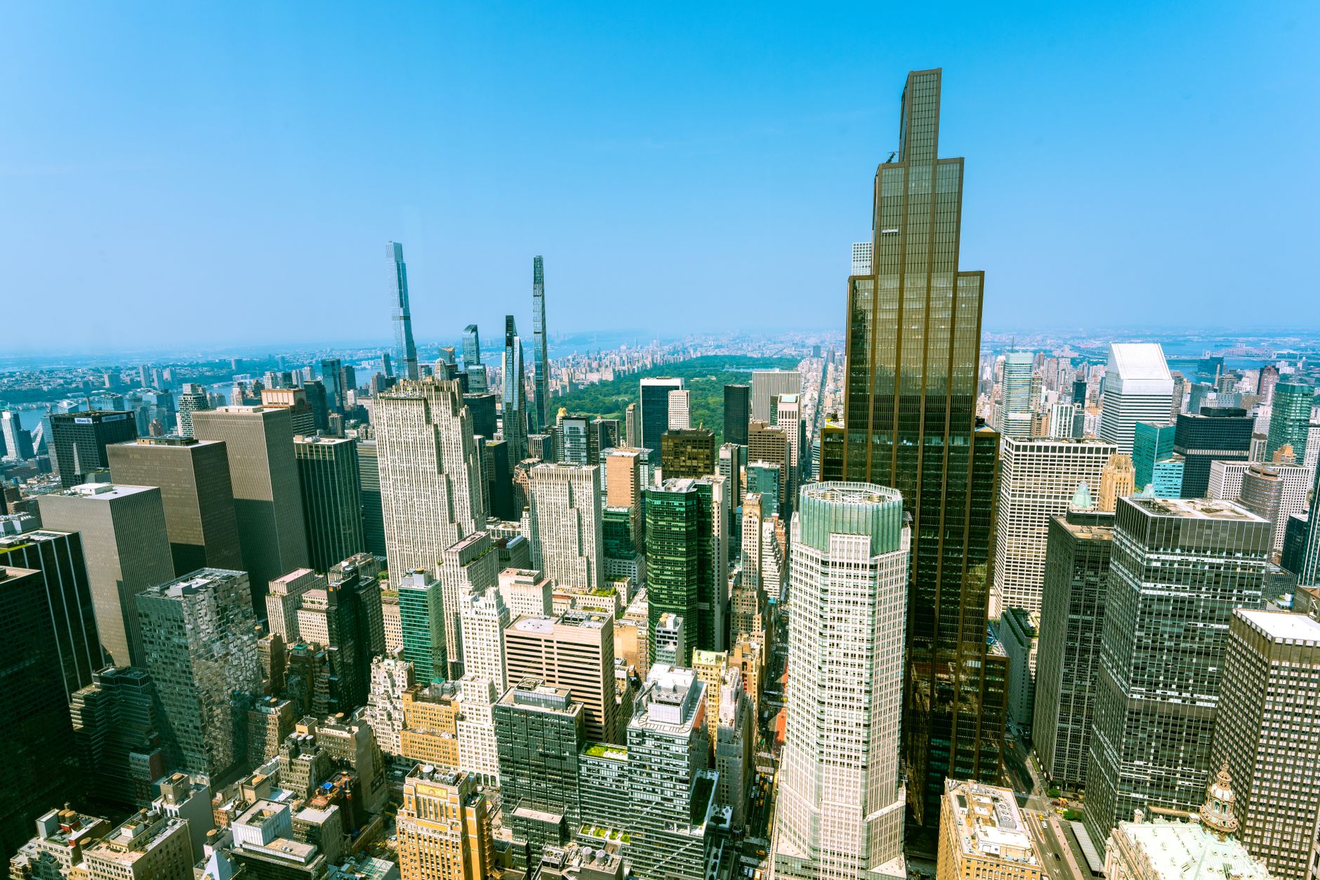 Stunning aerial view of the iconic New York City skyline on a bright sunny day.