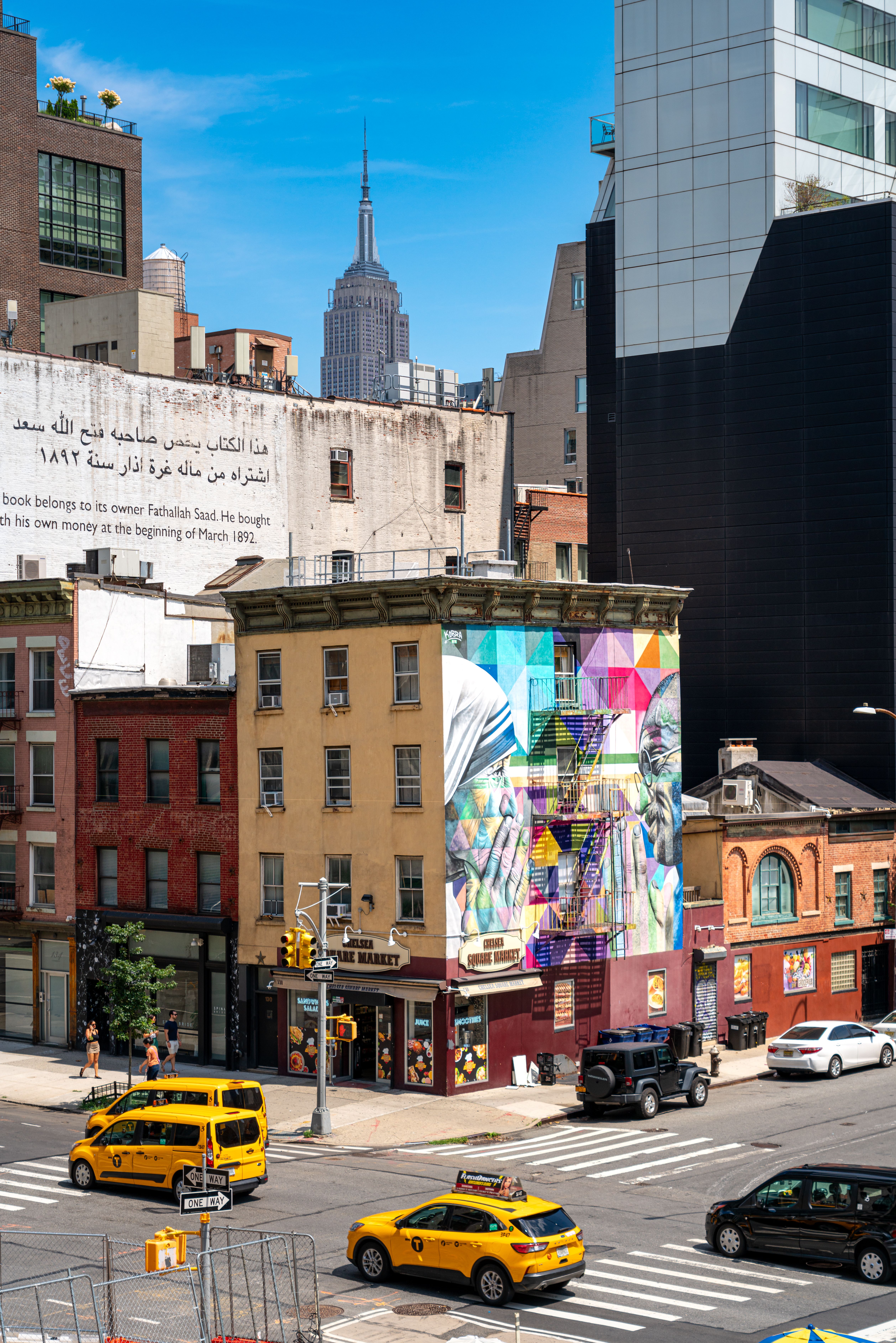 Colorful Street Scene in New York City with Empire State Building ...