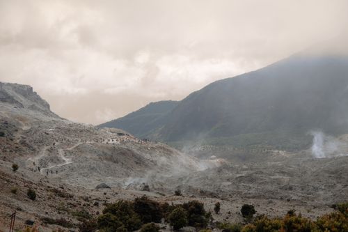 Free Explore the rugged beauty of West Java's volcanic landscape with lush greenery and misty mountains. Stock Photo