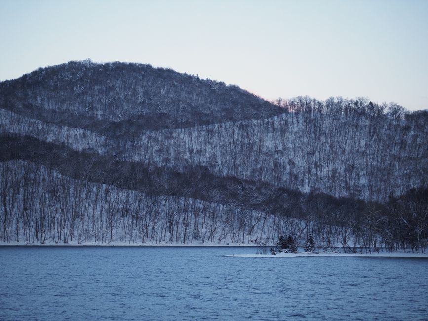 Snow-covered hills by Lake Toya at winter twilight, Hokkaido