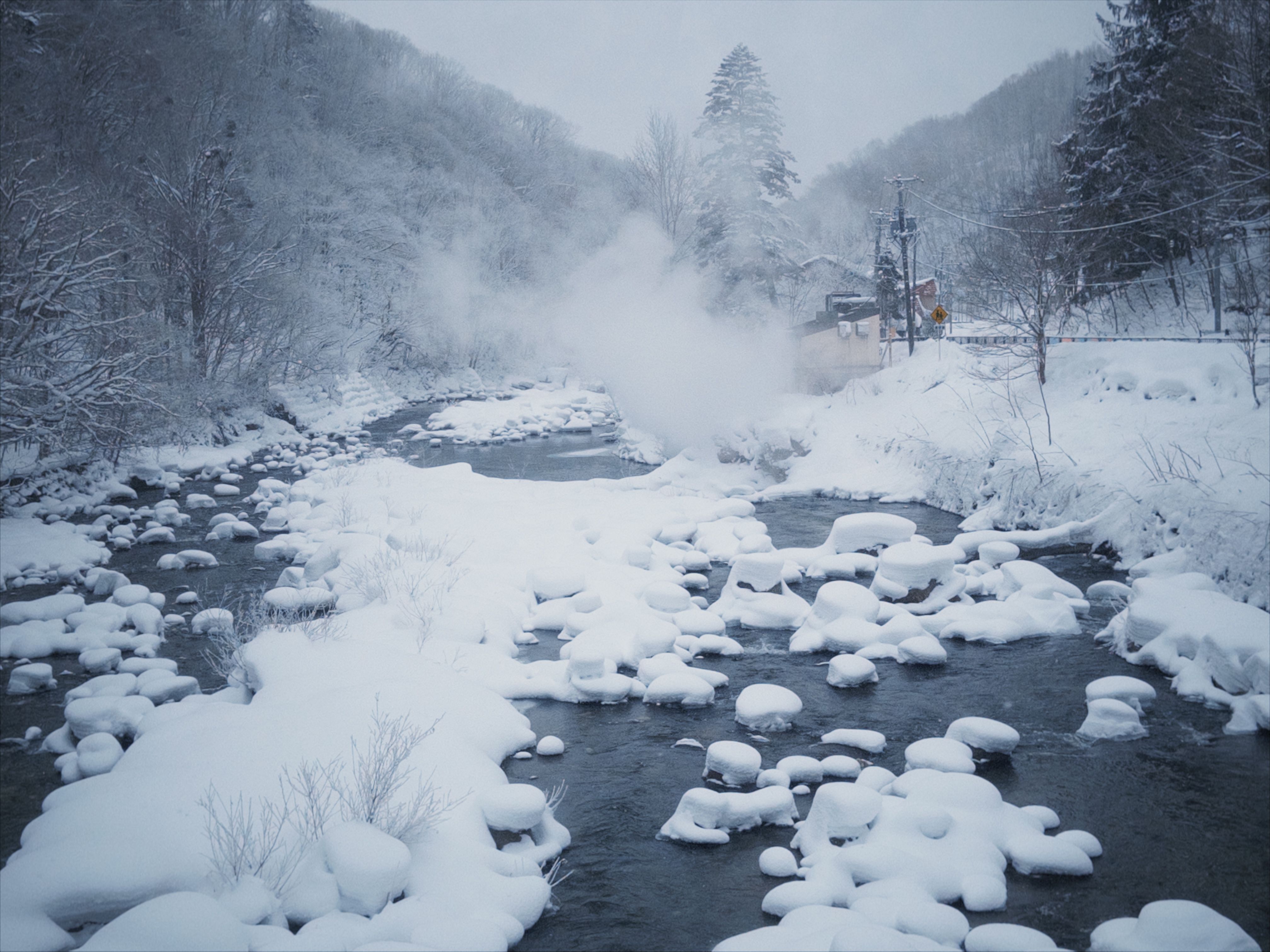 Serene Snowy River in Winter Wonderland · Free Stock Photo