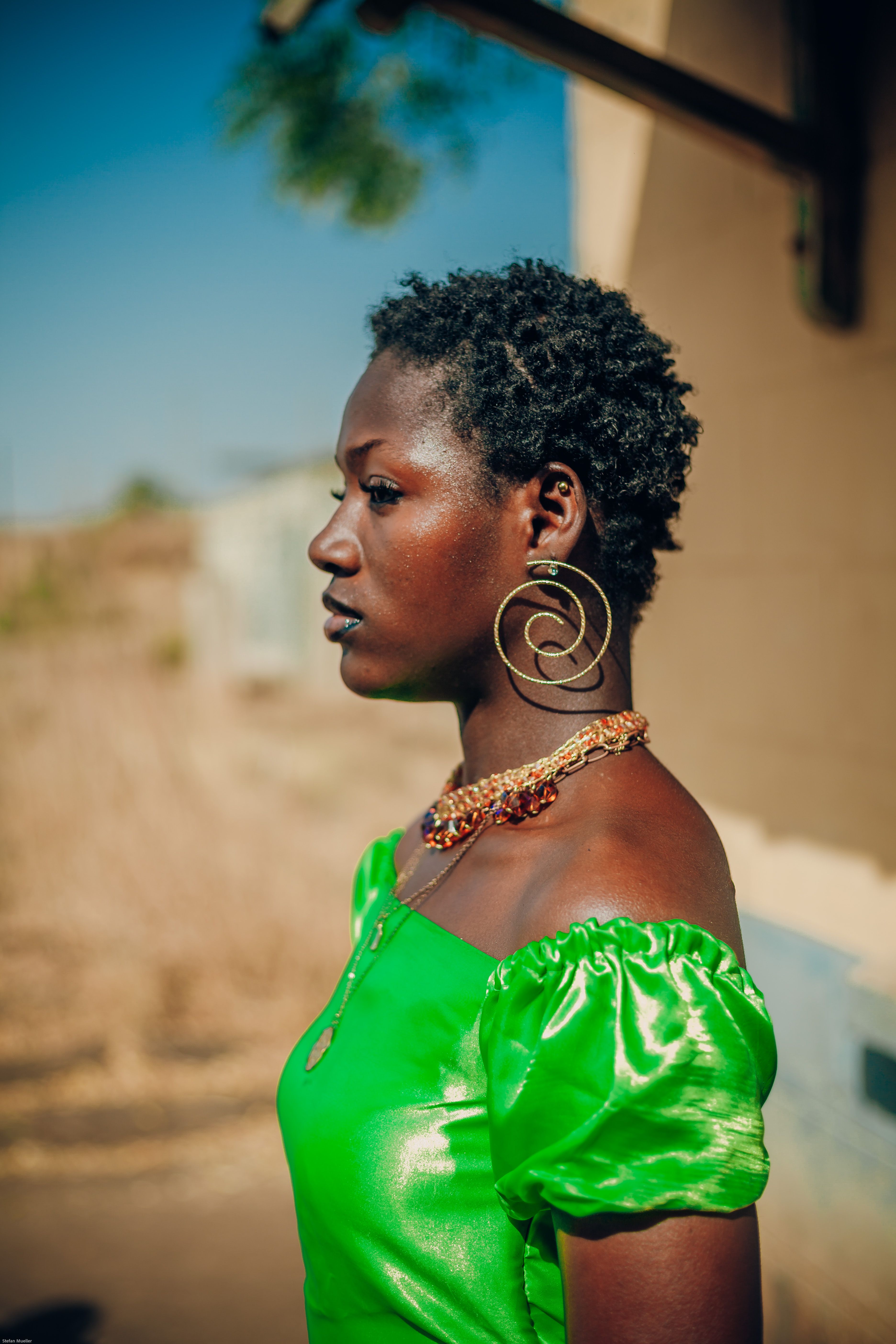 Profile Portrait of Woman in Green Dress Outdoors · Free Stock Photo