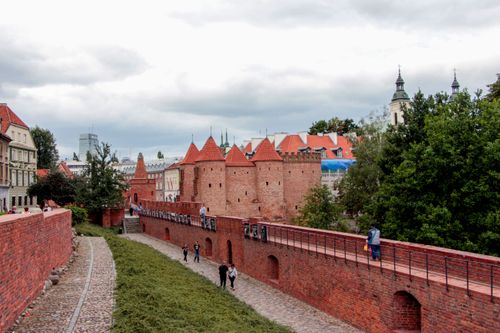 Free View of the historic Barbican and cityscape in Warsaw's Old Town, Poland. Stock Photo