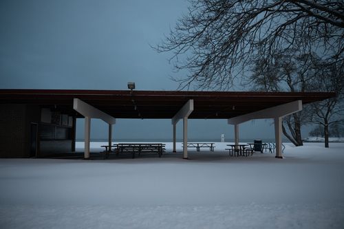 Free A quiet winter scene of a snowy pavilion at Cove Island Park, Stamford, Connecticut. Stock Photo