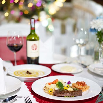 Fine dining with steak, wine, and pasta set in a luxurious restaurant in Vietnam.