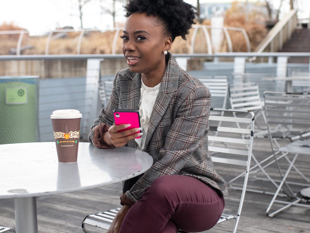 Woman Holding Smartphone with Pink Case