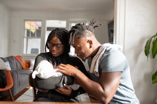 Free Parents Looking at their Baby Stock Photo