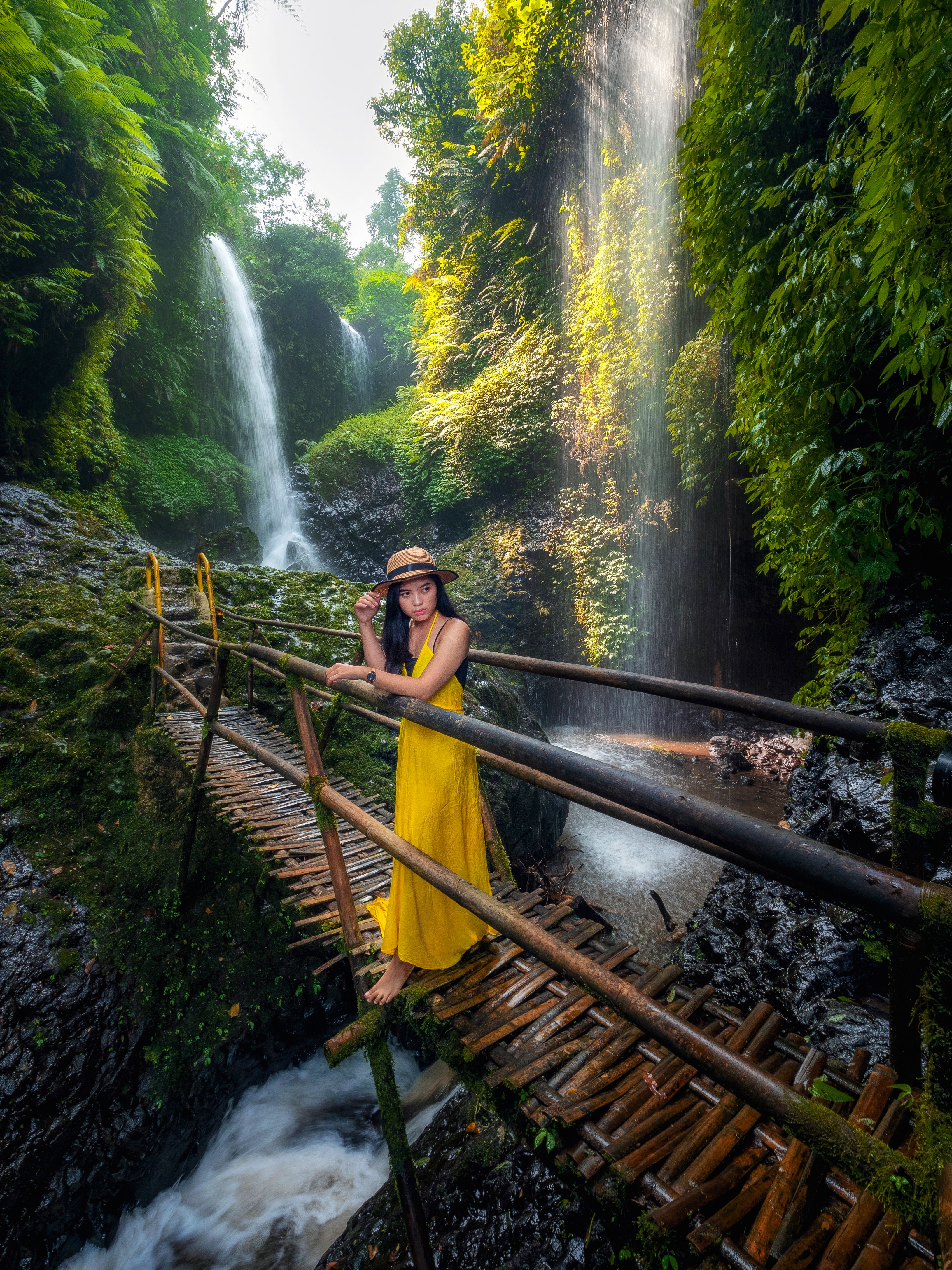 Woman Exploring Lush Waterfall in West Java · Free Stock Photo