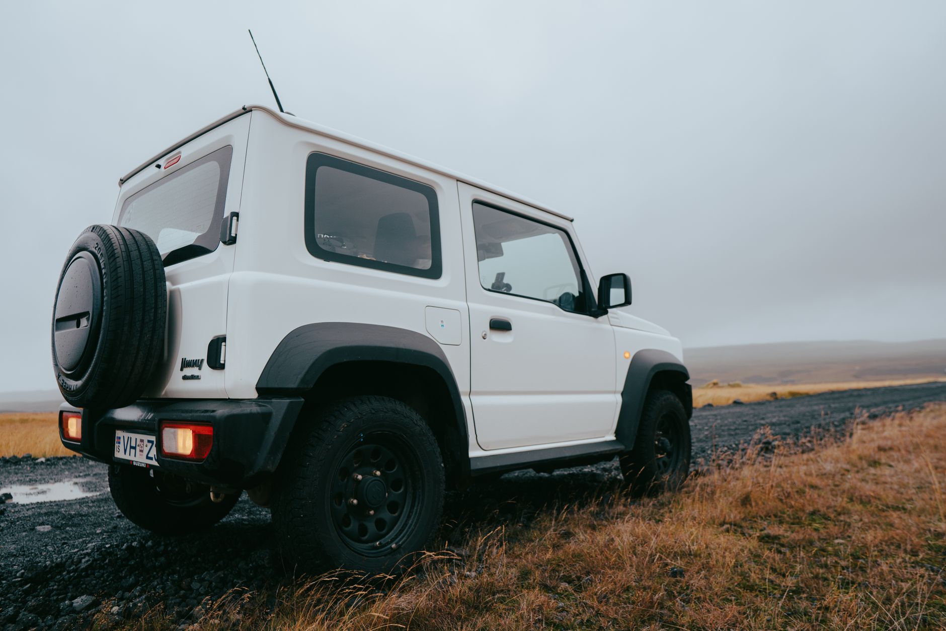 Off-road SUV on a loose gravel track, the kind of road Iceland car rental insurance gravel cover is made for