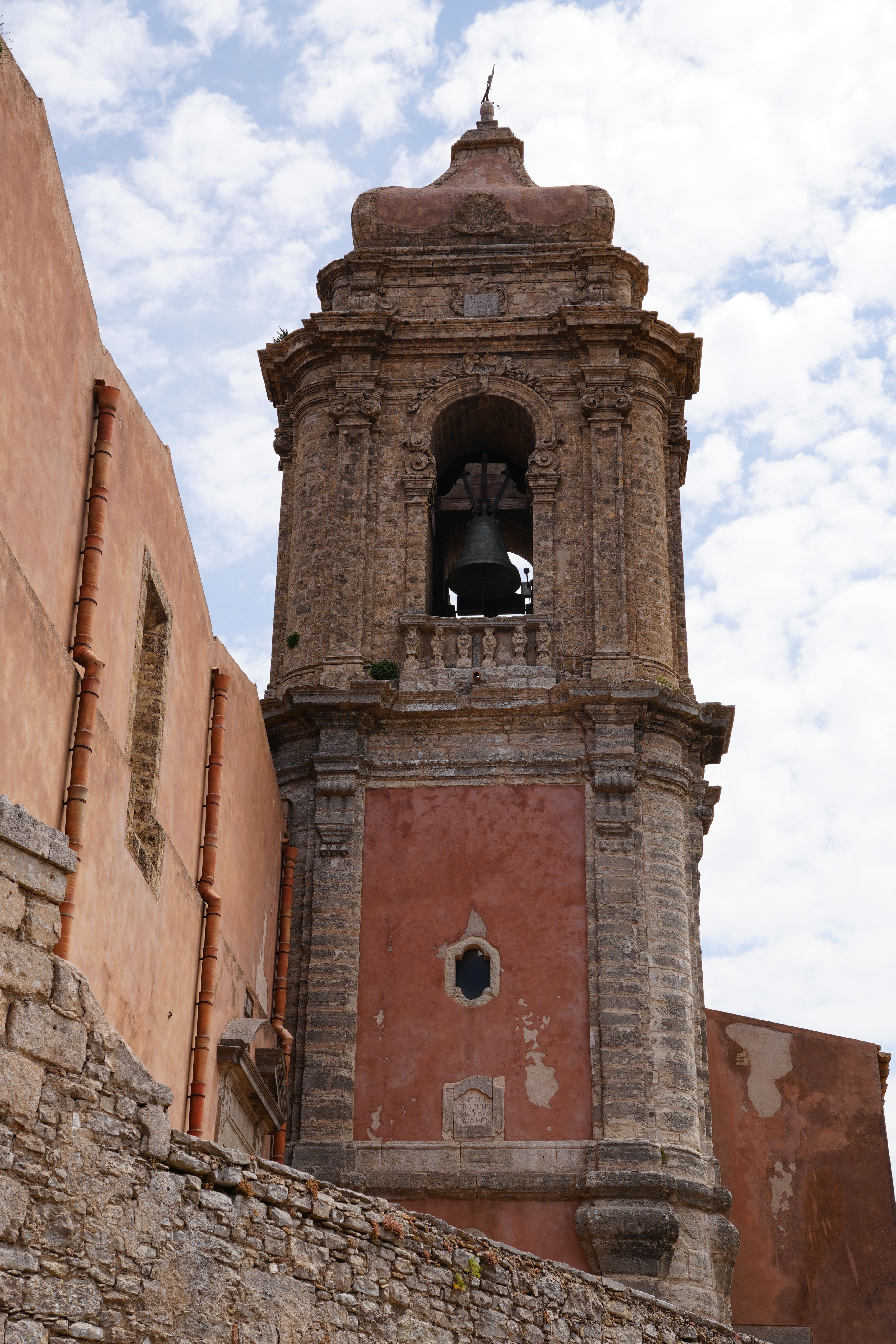 A stunning view of the ancient church bell tower in Erice, Sicily, showcasing historic architecture.