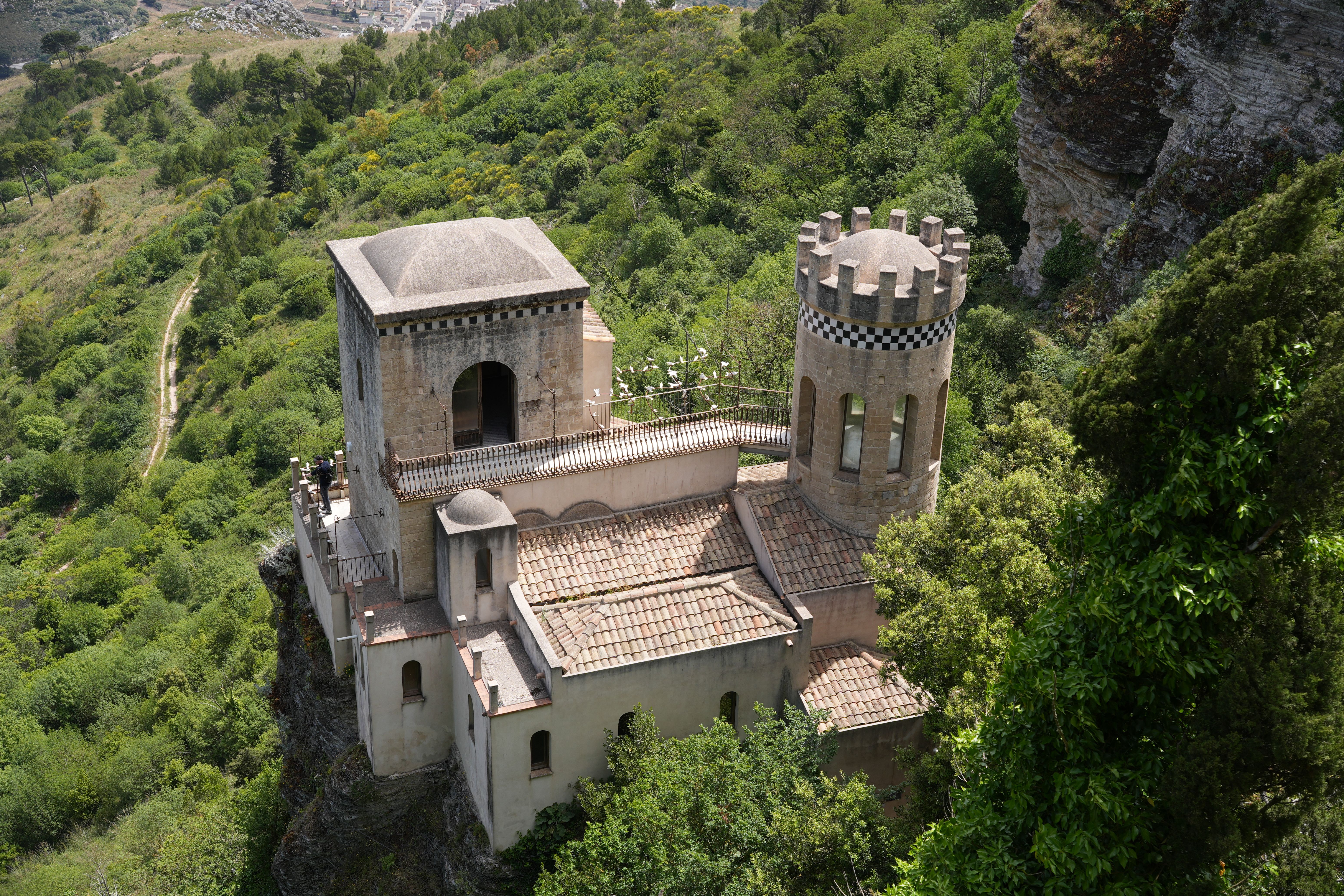 Aerial view of Torretta Pepoli, a historical tower surrounded by lush greenery in Sicily, Italy.