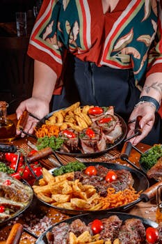 A vibrant platter featuring grilled meats, fries, and fresh veggies, ready for sharing.