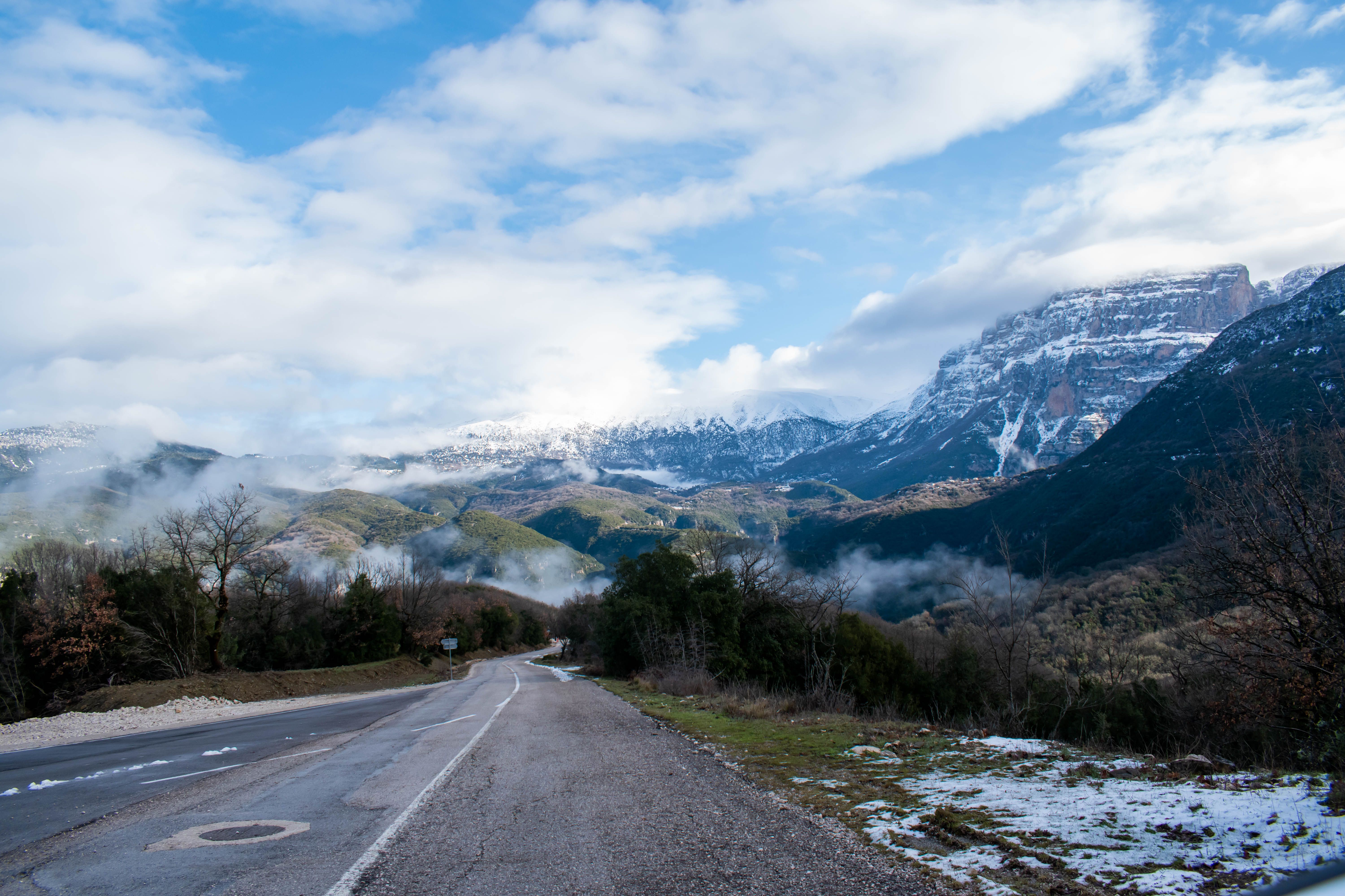 Breathtaking winter mountain landscape near Monodendri, Greece with a winding road. Breathtaking winter mountain landscape near Monodendri, Greece with a winding road.
