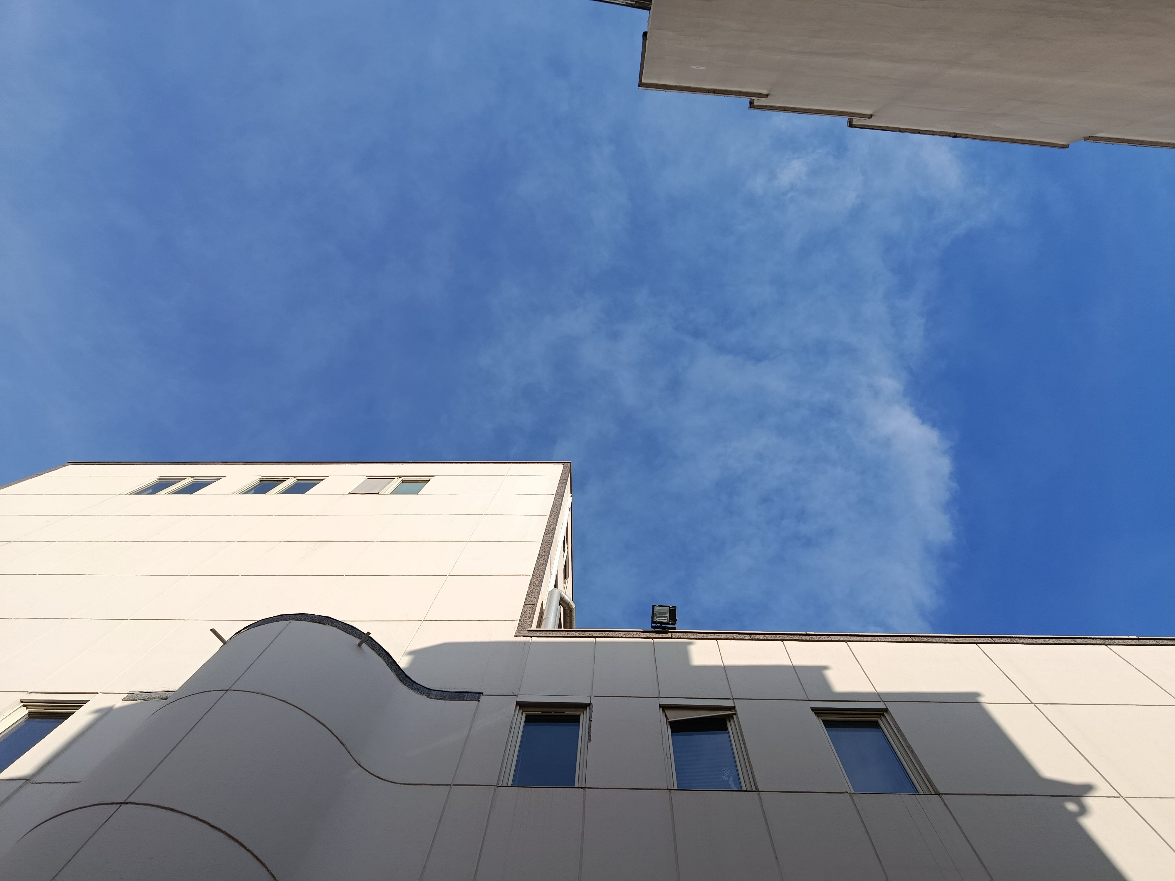 Modern Architecture Against Clear Blue Sky · Free Stock Photo