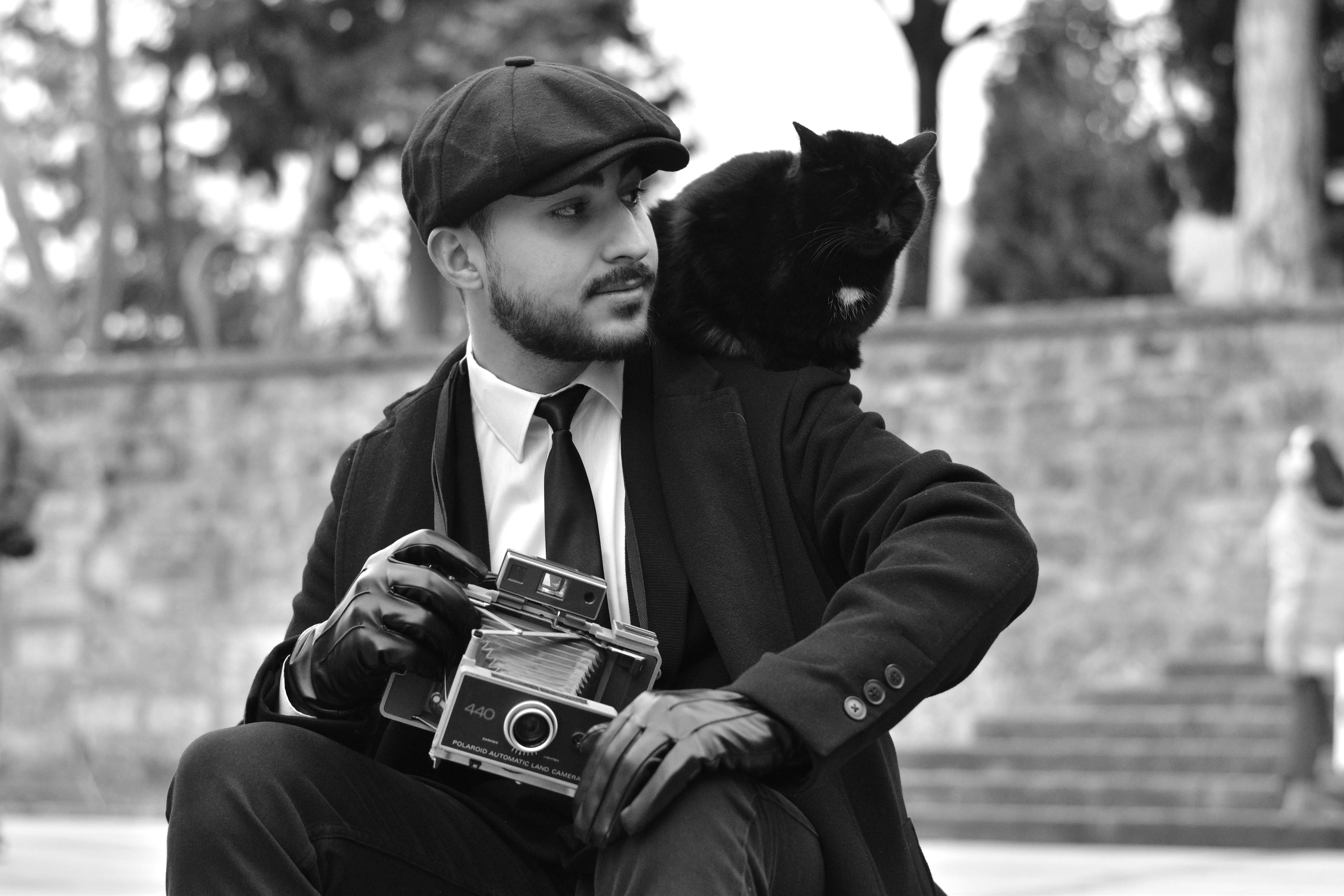 Vintage Style Portrait of Man with Classic Camera · Free Stock Photo