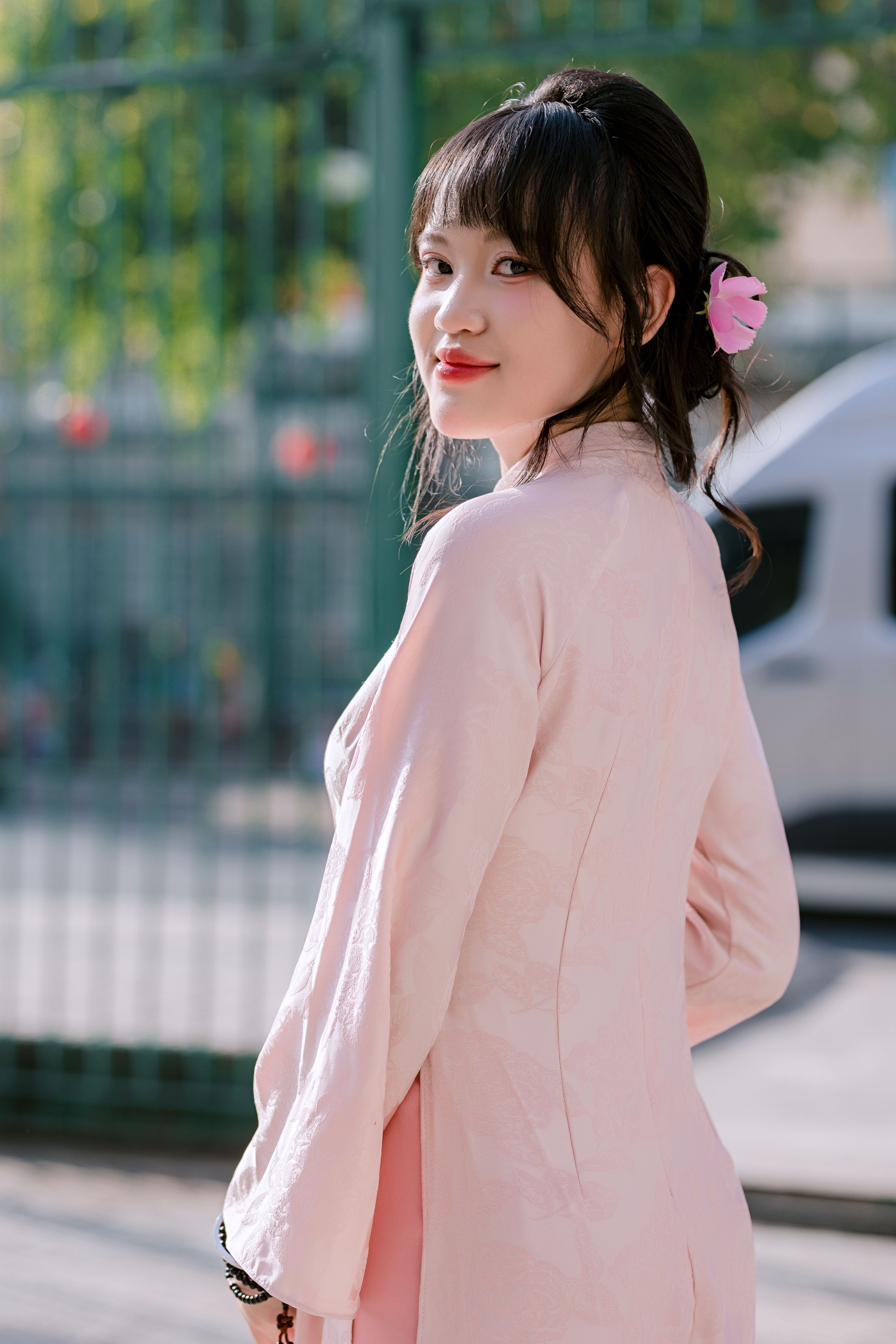 Elegant Portrait of a Woman in Pink Dress Outdoors · Free Stock Photo