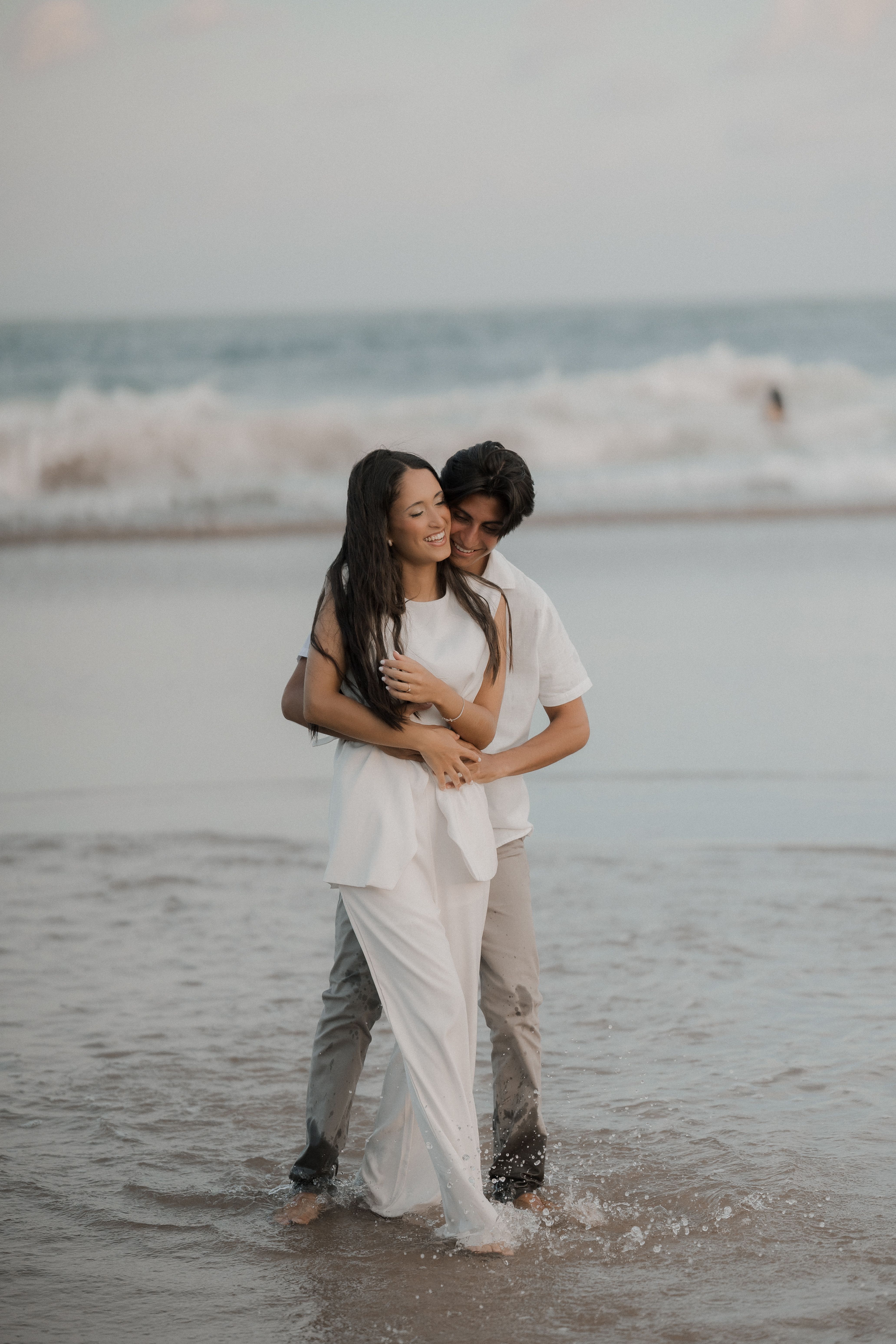 Romantic Couple Embracing on Beach at Sunset · Free Stock Photo
