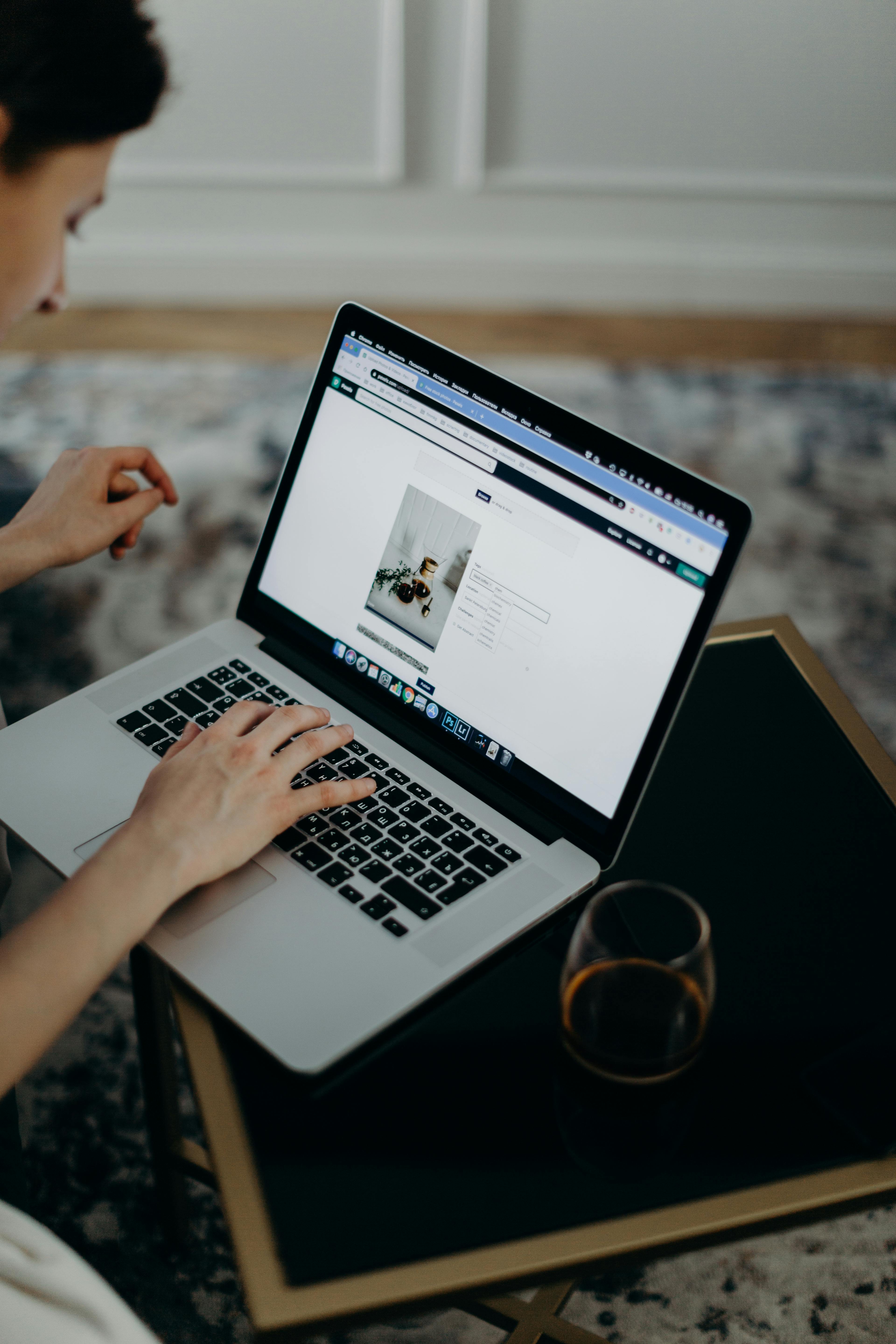 selective focus photography of person using macbook pro