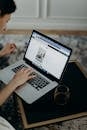 Selective Focus Photography Of Person Using Macbook Pro