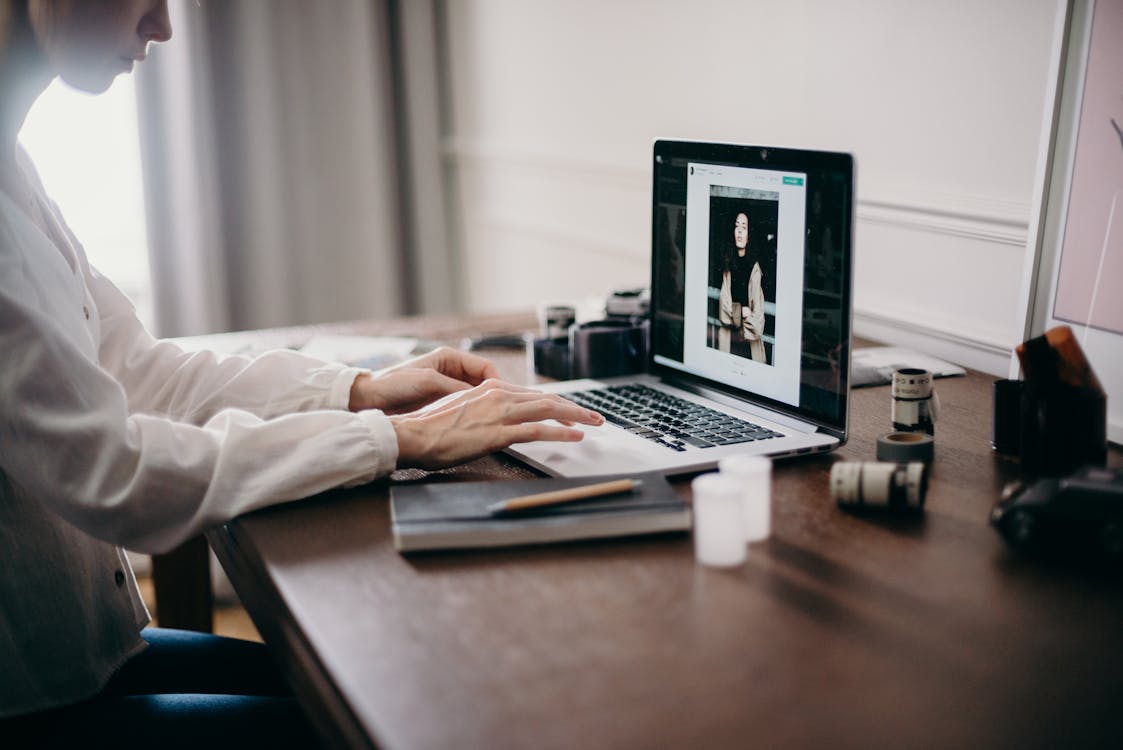 Free Selective Focus Photography of Woman Using Macbook Pro Stock Photo