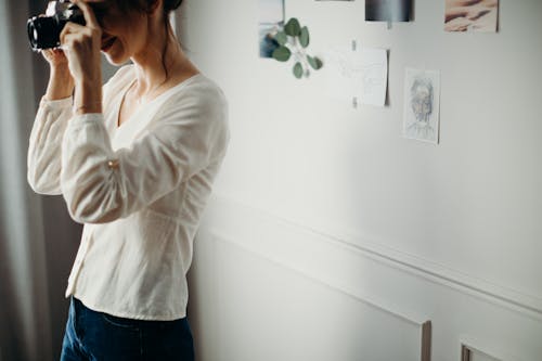 Woman Wearing White Blouse Taking Photo