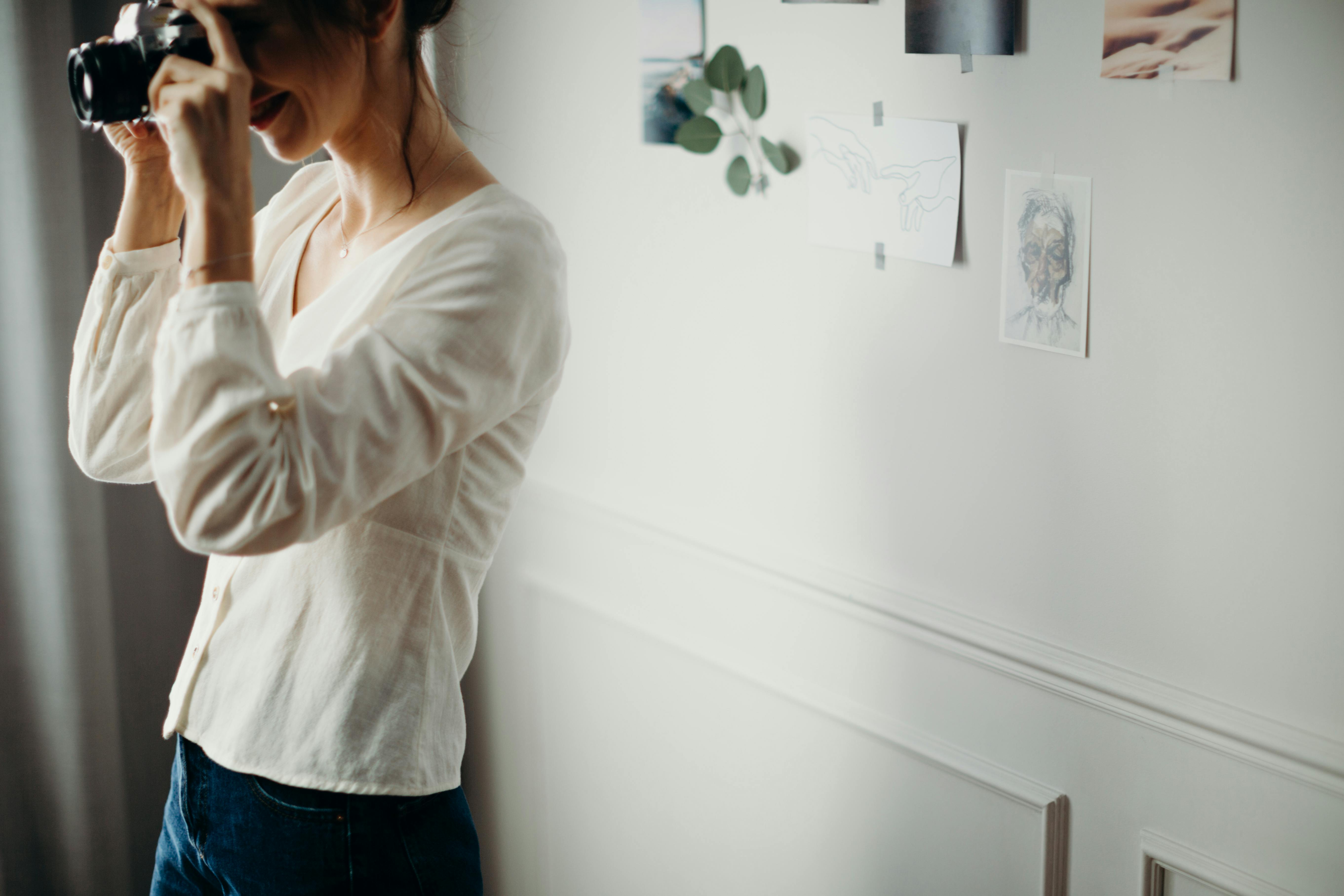 Woman Watching at Her Camera · Free Stock Photo