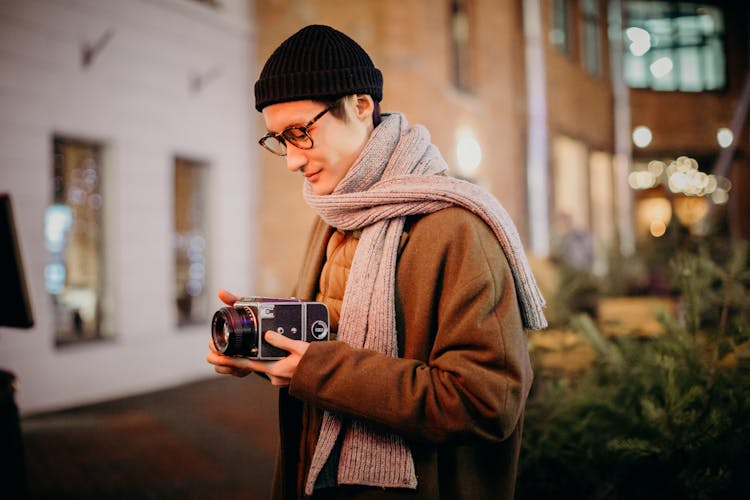 Man Holding Black Camera