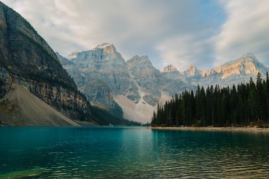 Stunning landscape of Moraine Lake with turquoise waters and mountain backdrop in Banff National Park, Canada.