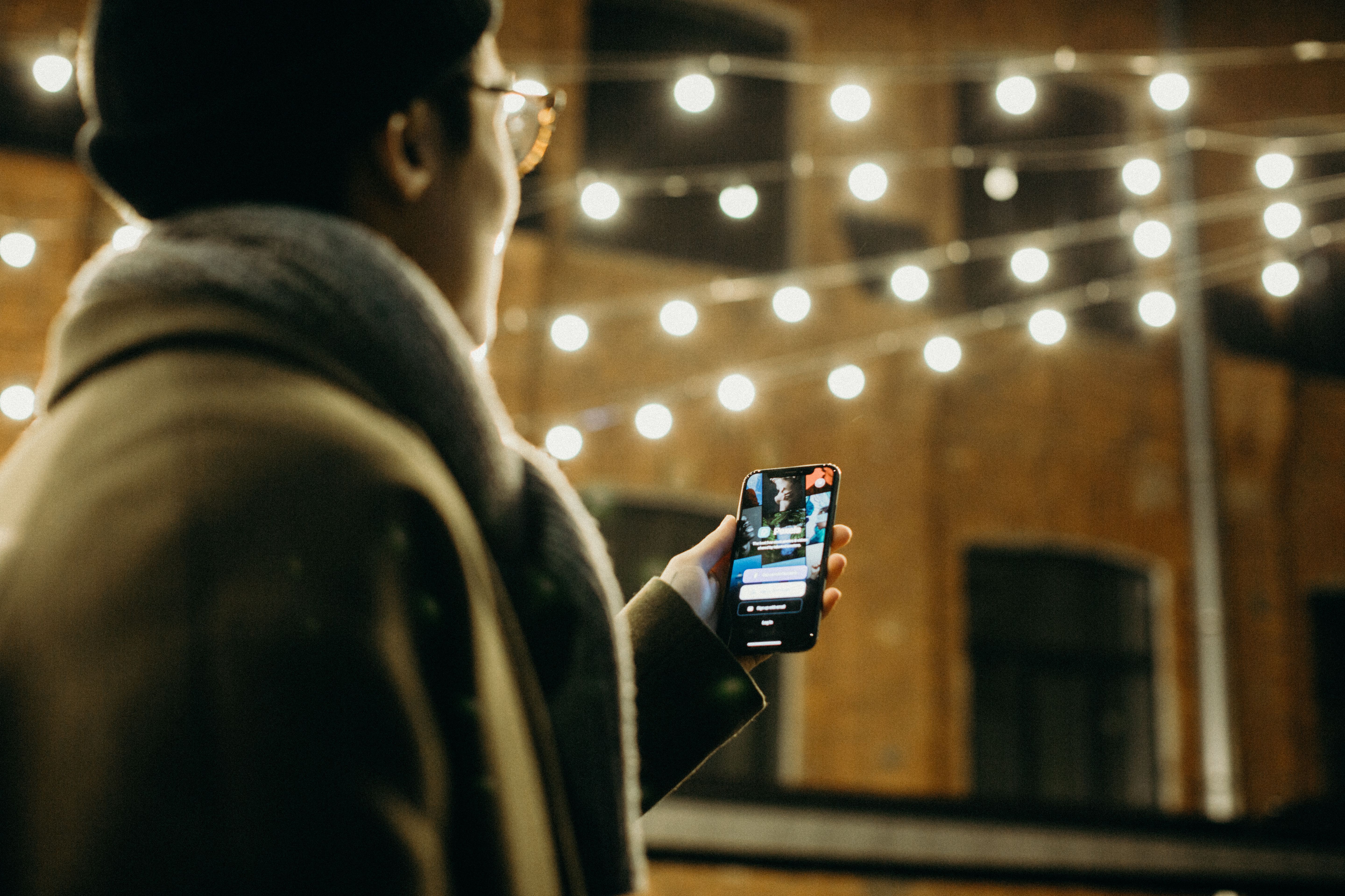 Image Name homeowner controlling outdoor lights using smartphone app