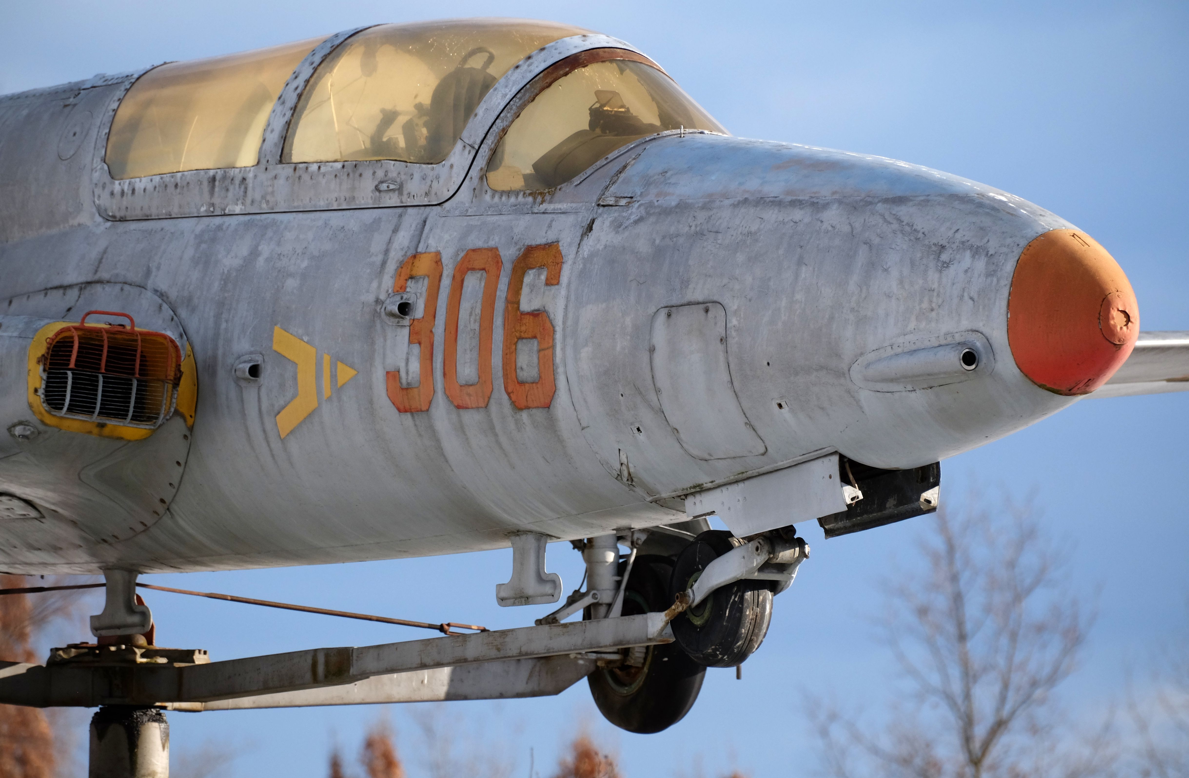 Vintage Military Jet Plane on Display Outdoors · Free Stock Photo