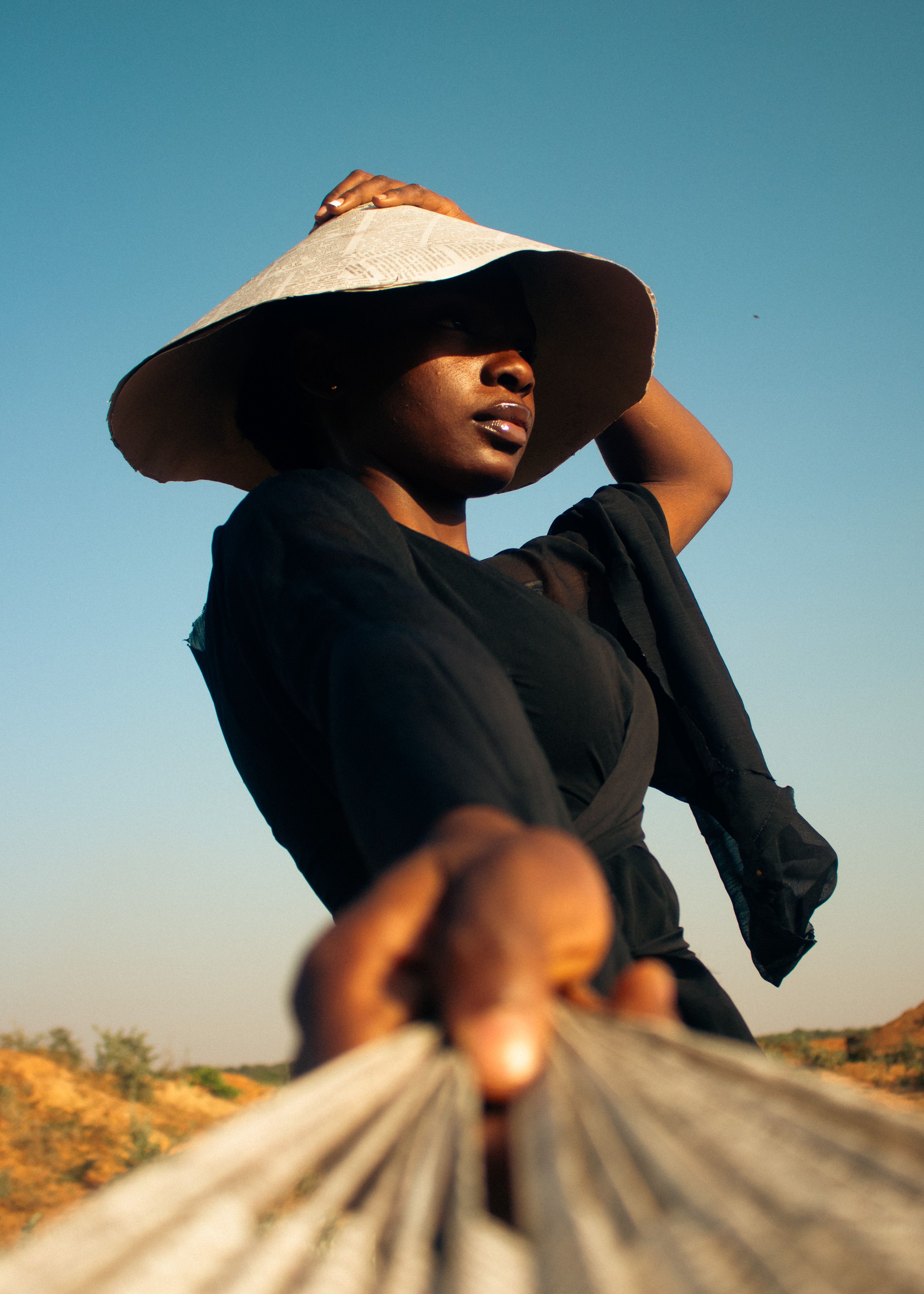 Stylish Woman Posing Outdoors in Sun Hat · Free Stock Photo — free download