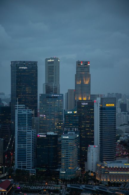 A stunning view of Singapore's skyscrapers at dusk, showcasing modern architecture and urban city life.
