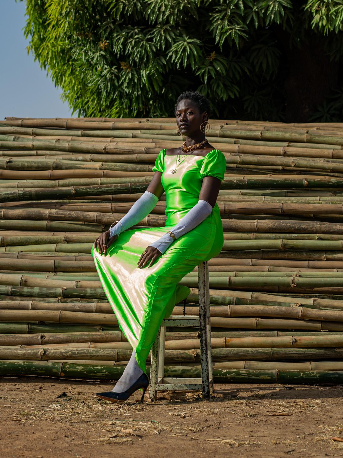 Elegant Woman in Vibrant Green Dress Outdoors · Free Stock Photo
