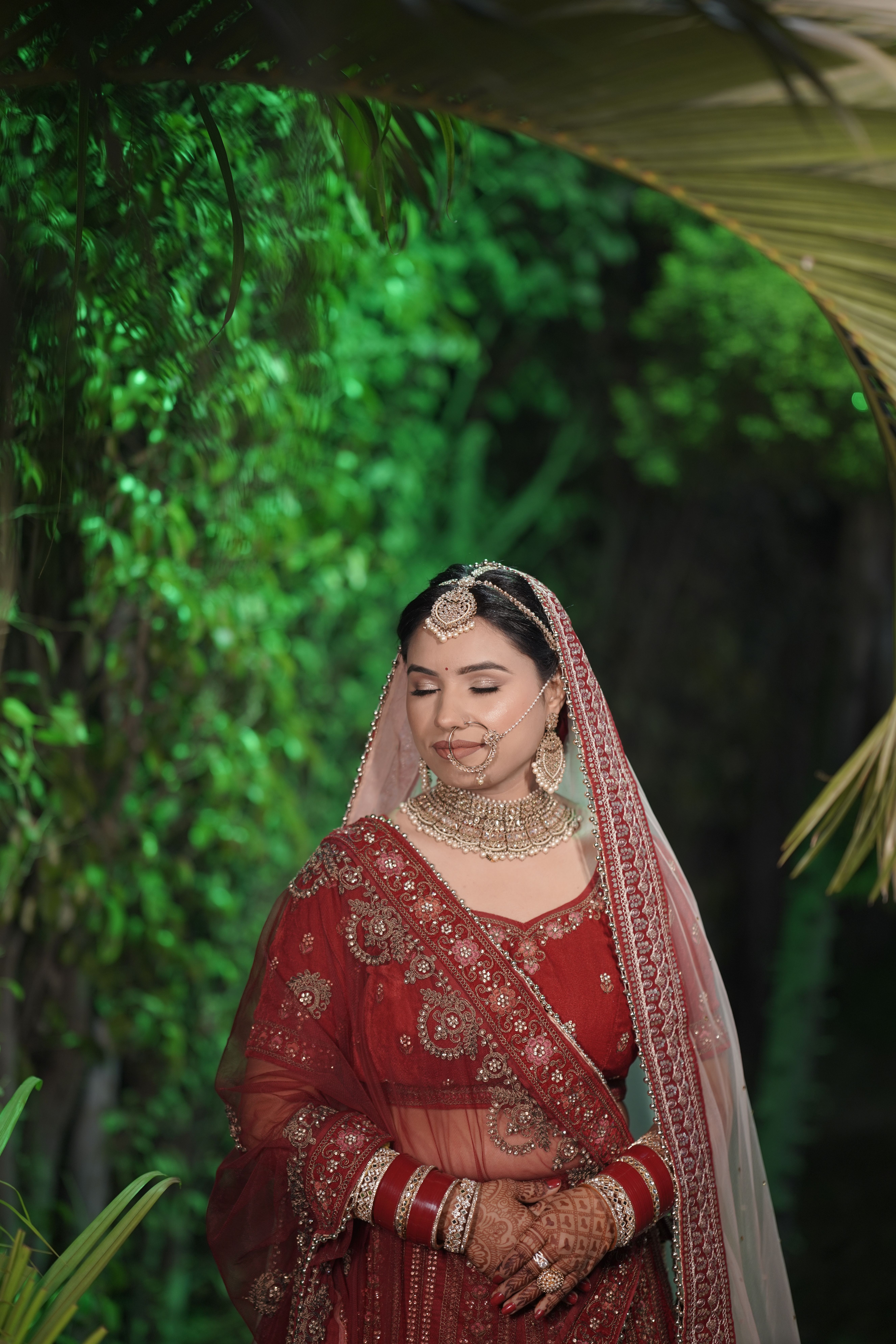 Bride Wearing Traditional Jewelry to Red Dress  Free Stock Photo