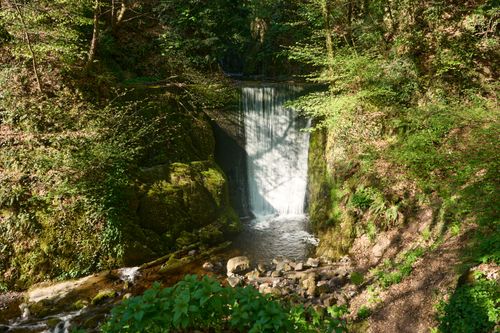 Free Peaceful waterfall in Alva Glen with dappled autumn light, Scotland. Stock Photo