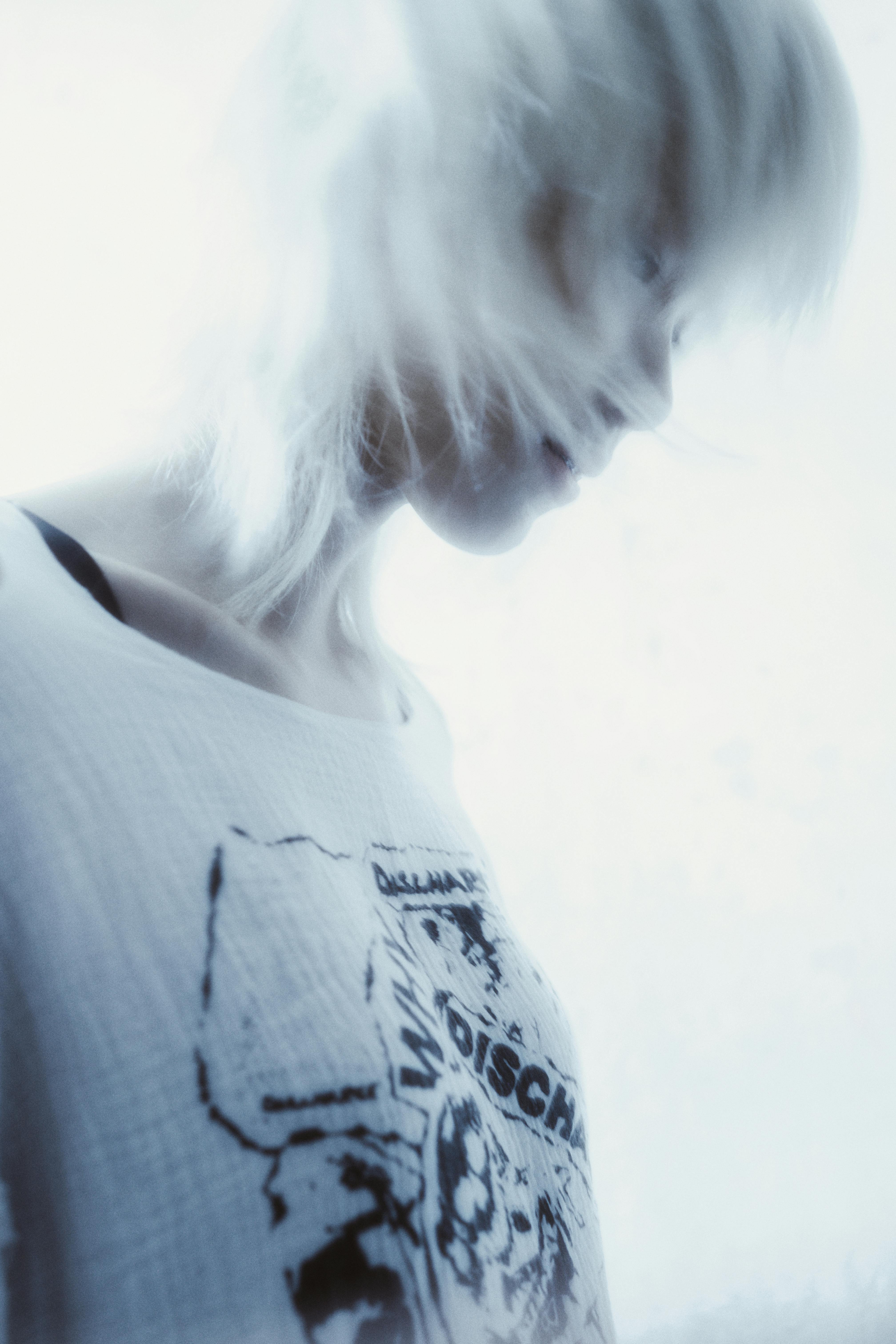 A soft focus image of a woman creating a dynamic, dreamy effect.