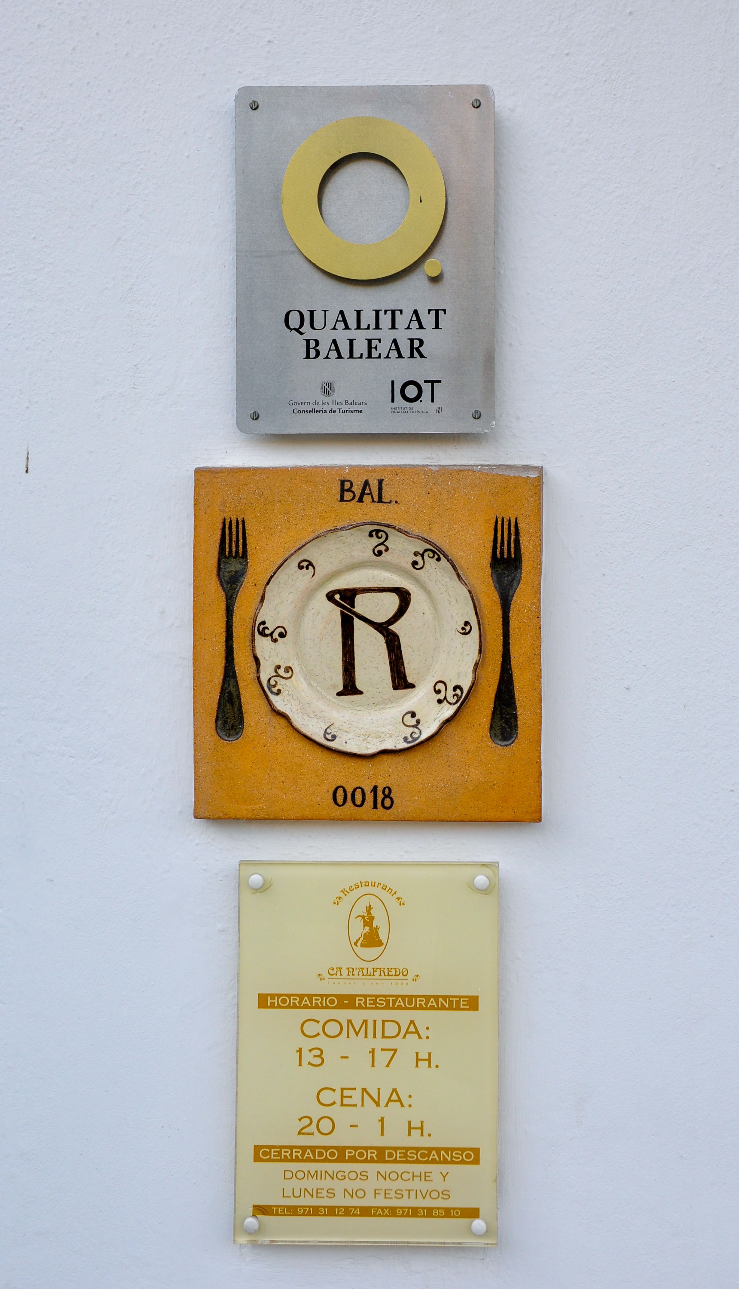 Charming restaurant exterior signage showcasing local culinary heritage in Eivissa, Spain.