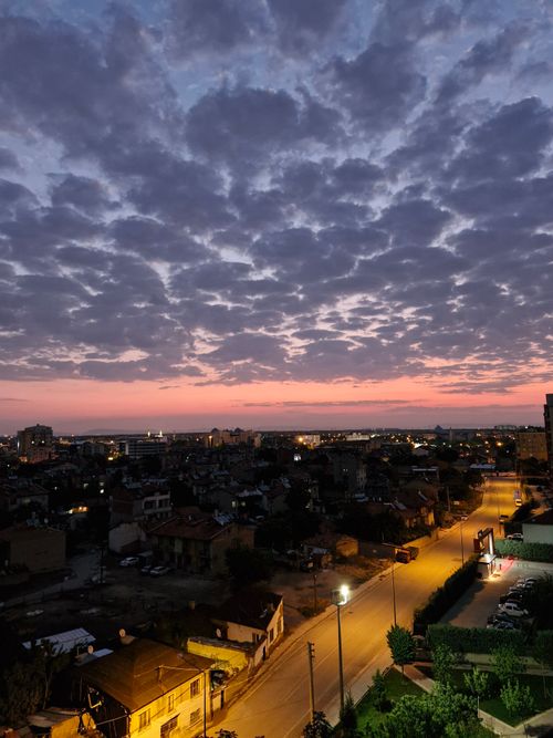 Free Evening cityscape of Konya, Türkiye, showcasing vibrant sunset skies and dramatic clouds. Stock Photo