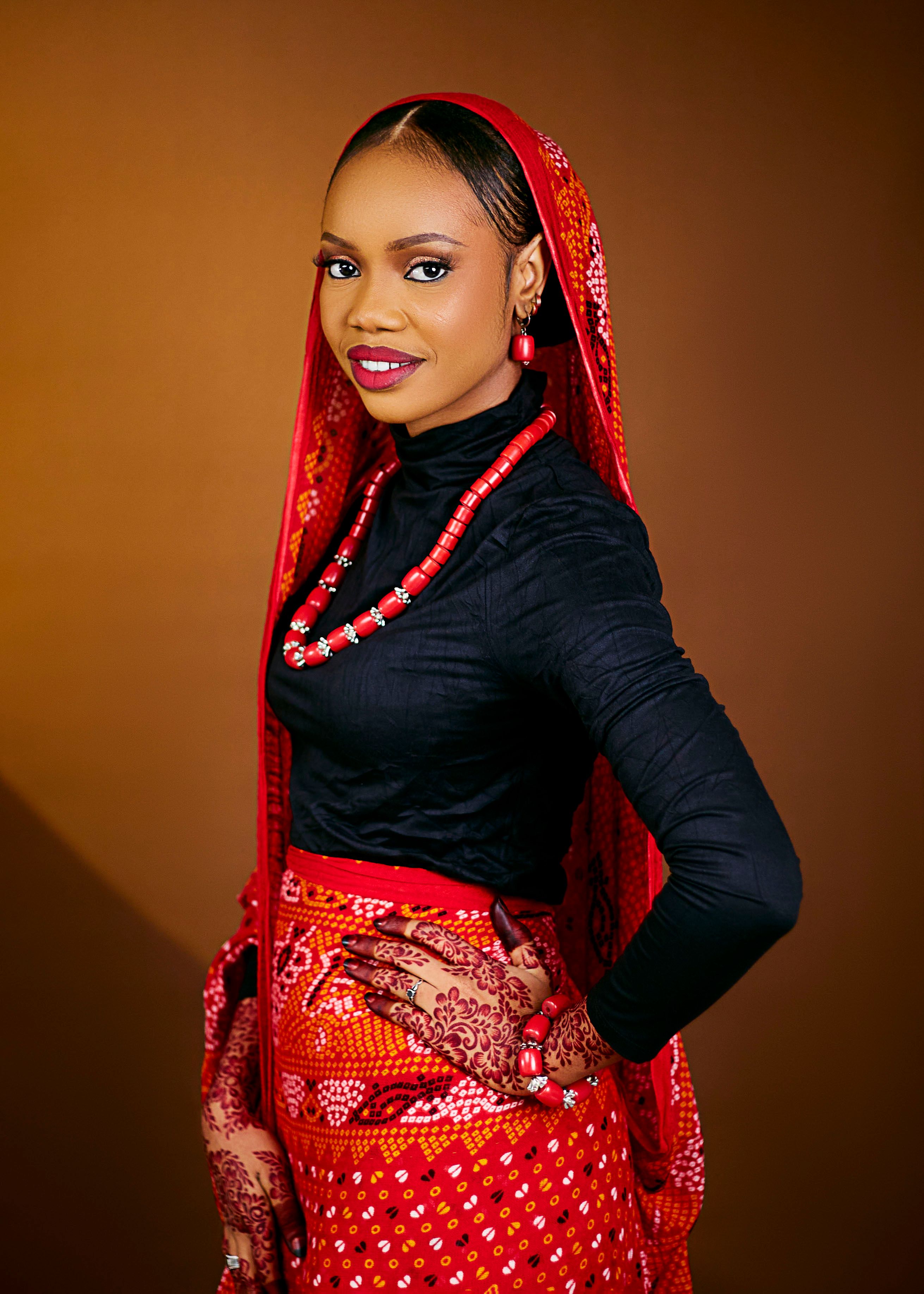 A stunning portrait of a woman wearing colorful traditional attire, exuding elegance and grace.