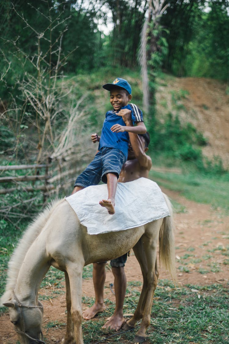 Kid Riding A Horse