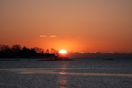 Free Breathtaking winter sunrise over Cove Island Park from Stamford, Connecticut, showcasing a serene seascape. Stock Photo