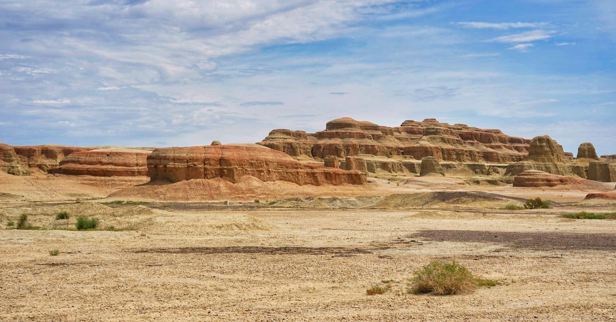 Red Dessert Rocks Stunning Red Desert Rock Formation Under Blue Sky · Free Stock Photo