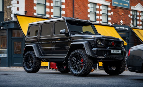 Stylish black SUV parked in urban street of Southampton, England highlighting automotive luxury.