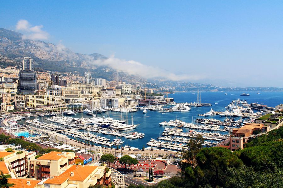 Grand marina filled with superyachts at midday
