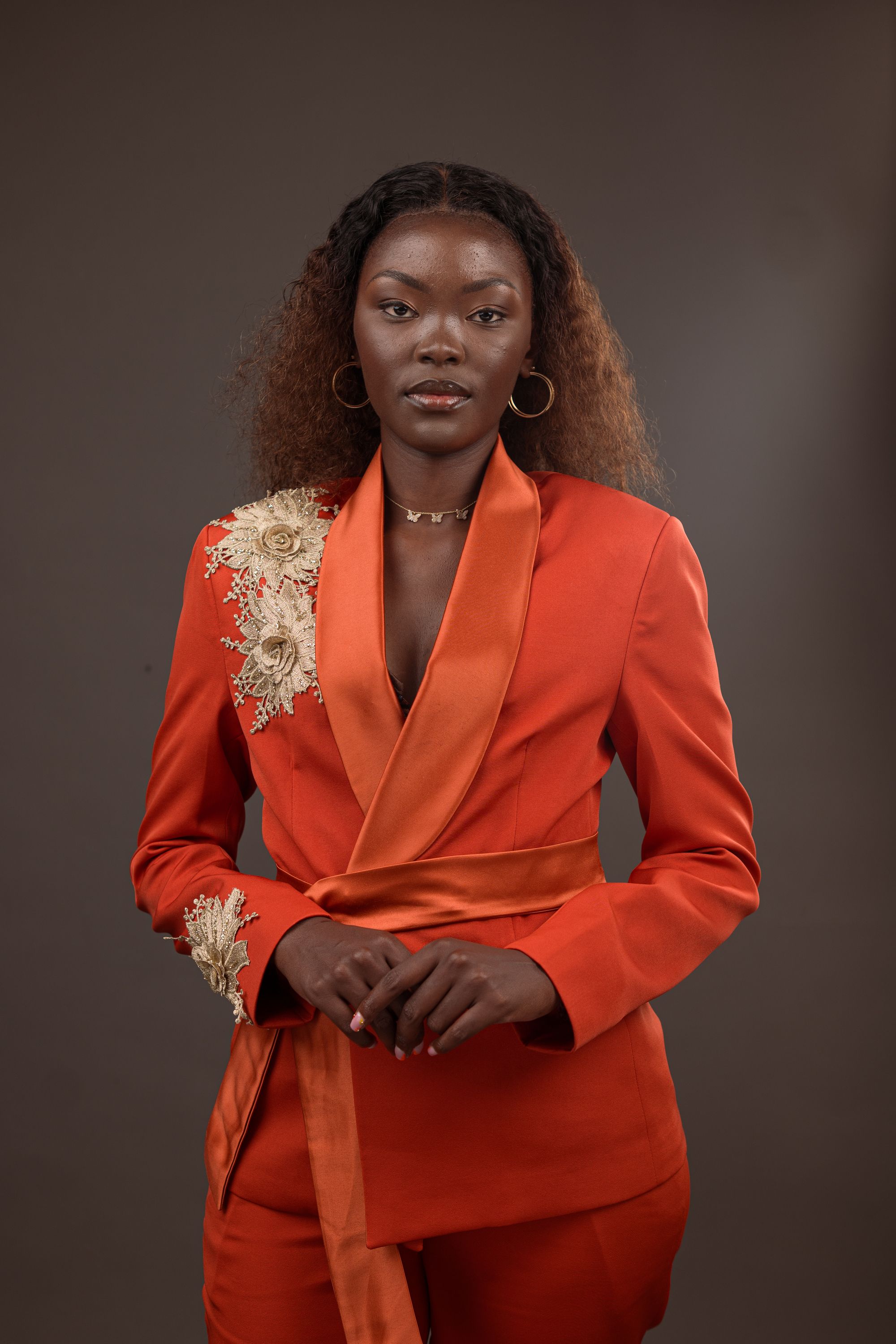 Elegant Woman in Stylish Orange Suit Portrait · Free Stock Photo